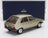 Gold Peugeot 104 ZR scale model car by Norev, showcased with Vroomi for collectors.