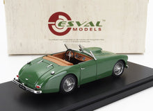 Green classic convertible model car with tan interior on black display base, offered via Vroomi