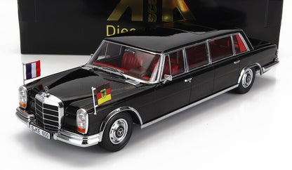 Black classic Mercedes limousine model with red interior, German and French flags, available on Vroomi