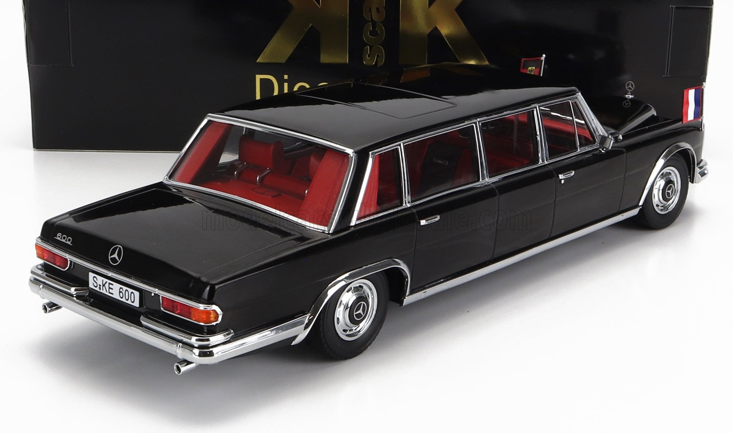 Black vintage Mercedes 600 model car with red interior and French flags, available on Vroomi