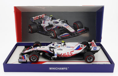 Haas F1 car model VF-21 number 47 in display box by Minichamps, offered on Vroomi