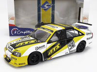 Geel en zwart Opel raceauto schaalmodel met ATS-sponsoring en DEKRA 36 livrei, getoond in Vroomi-verpakking