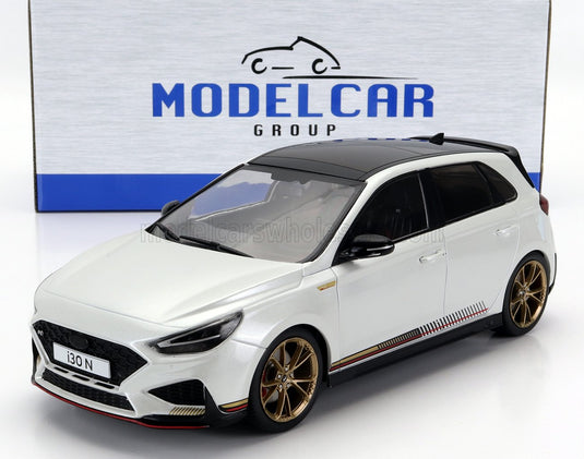 White Hyundai i30 N scale model car with gold rims, displayed by ModelCar Group — perfect for Vroomi collectors.