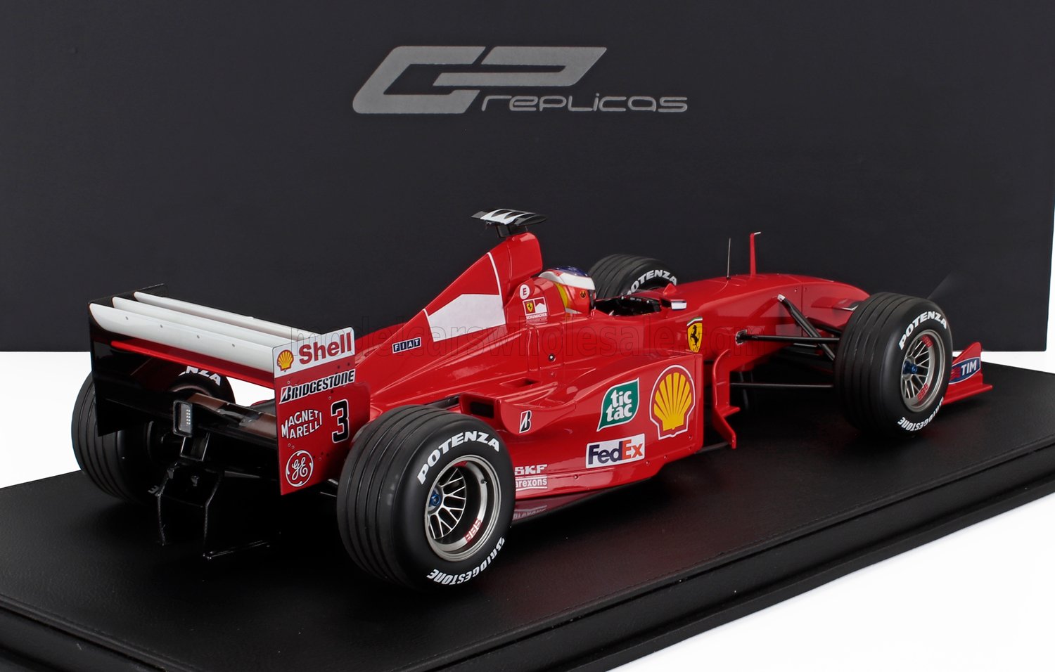 Red Ferrari F1 car model with Shell, Bridgestone, and FedEx logos, available on Vroomi