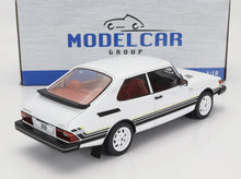 White Saab 900 turbo 1/18 scale model car with black and yellow stripes, available on Vroomi