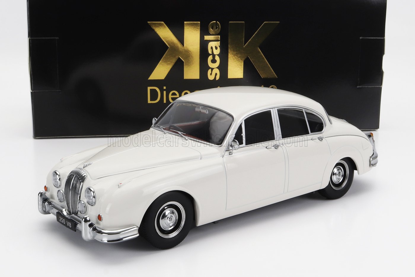 White classic Jaguar 250 V8 model car with chrome details, available on Vroomi