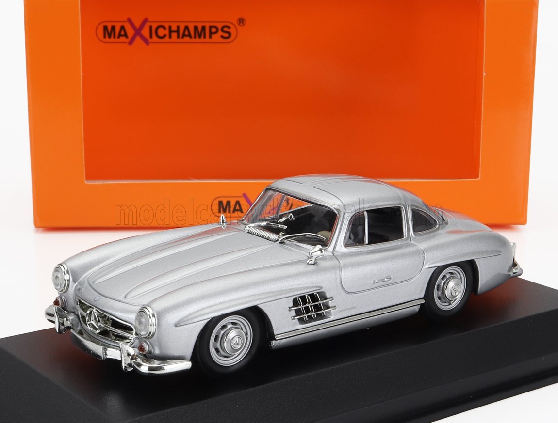 Silver Mercedes-Benz 300SL model car displayed on black base with orange Maxichamps box, also offered on Vroomi