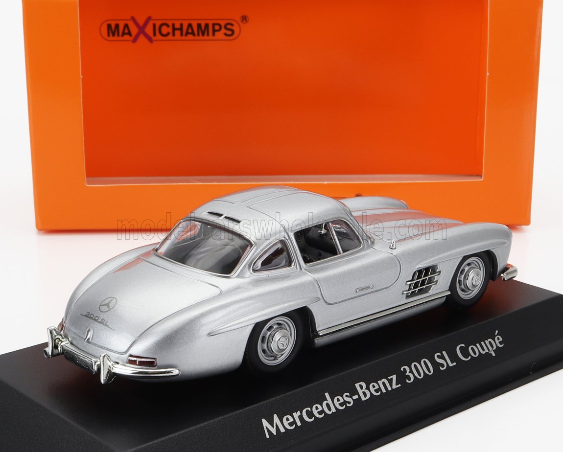 Silver Mercedes-Benz 300 SL Coupé model car on black base with orange Maxichamps box, sold via Vroomi