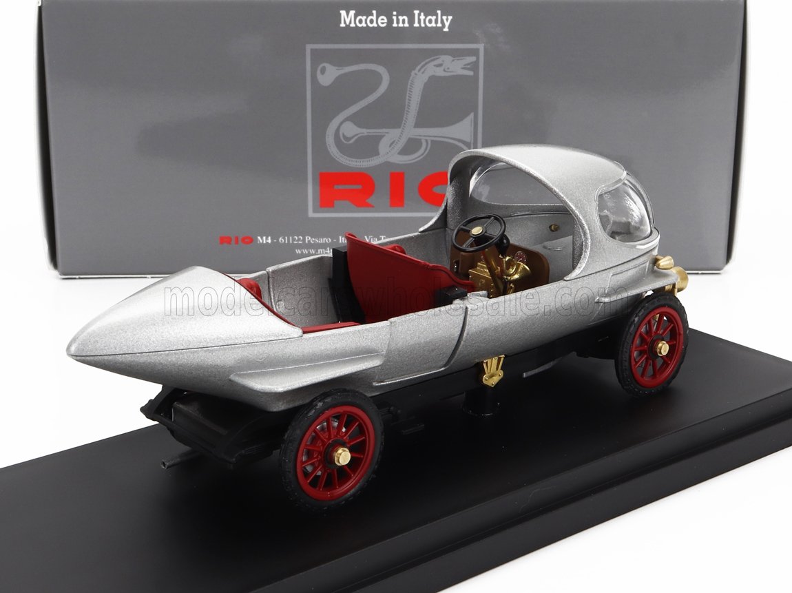 Silver vintage three-wheeled model car with red seats and wheels, displayed with Rio branded box, offered on Vroomi