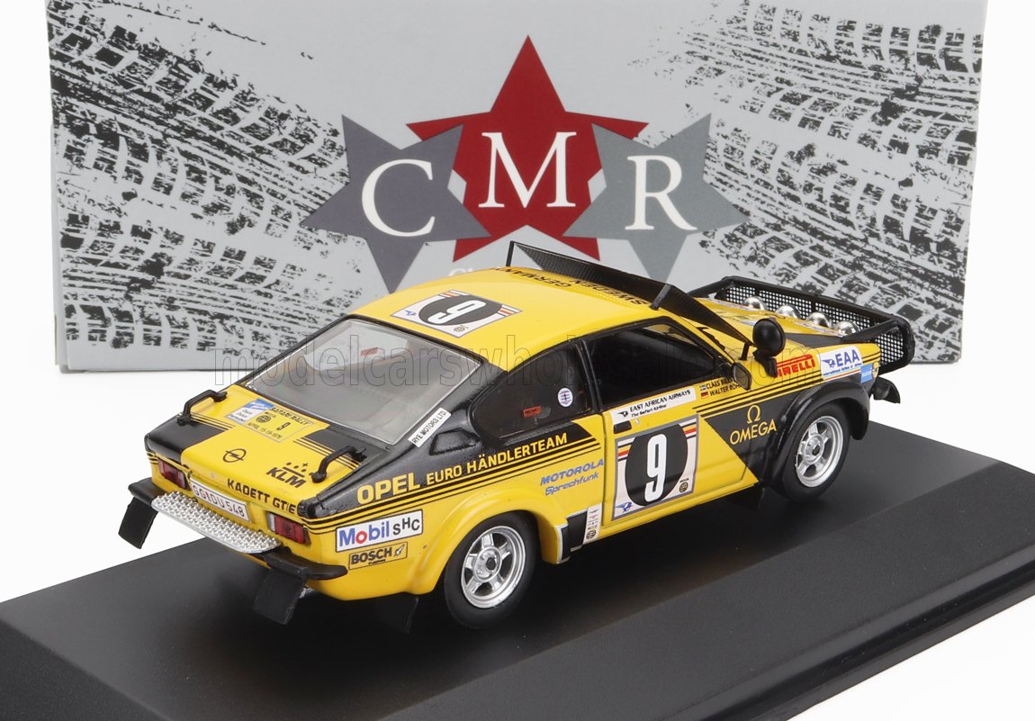 Yellow Opel Kadett GT/E rally car model with number 9, detailed sponsor decals, displayed on stand, offered on Vroomi