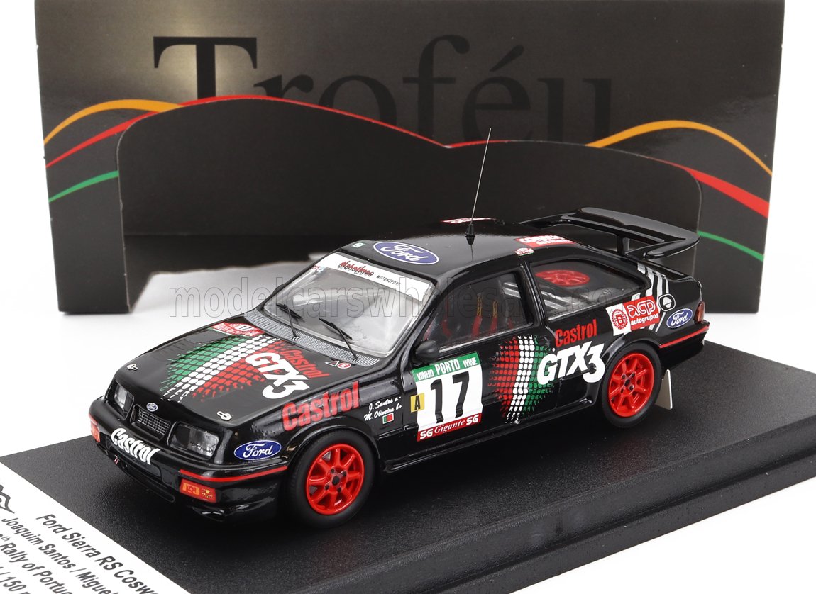 Ford Sierra RS Cosworth rally car model with Castrol GTX3 livery and red wheels, available on Vroomi