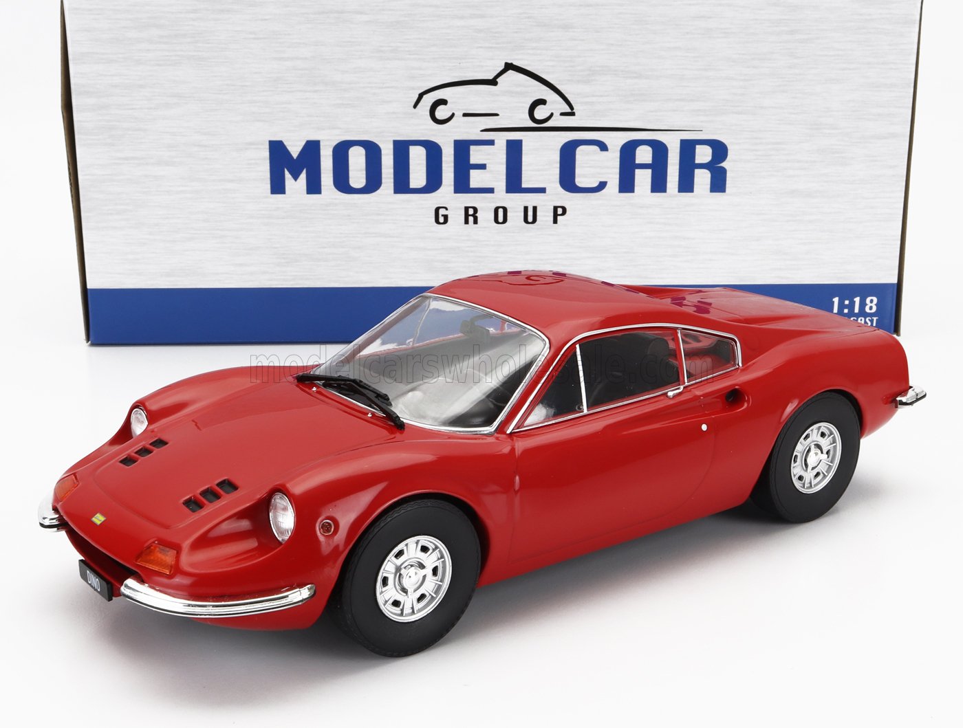 Red 1:18 scale die-cast Dino model car replica in front of Model Car Group box, available at Vroomi