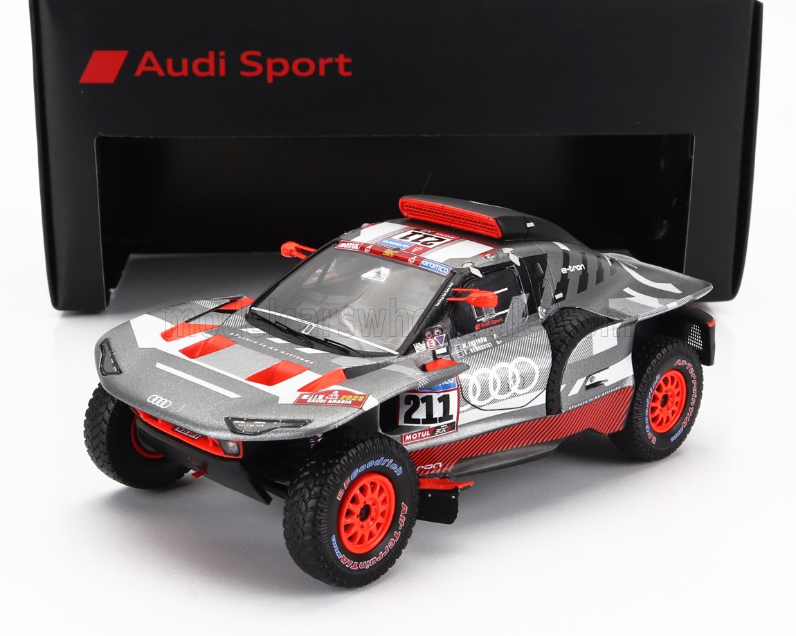 Audi Sport electric rally car model with red accents and racing decals, showcased with branded black box, offered on Vroomi