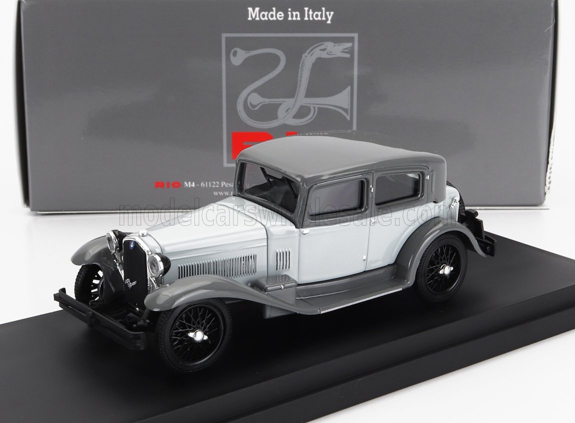 Grey and light blue classic vintage car model with box in background, available on Vroomi