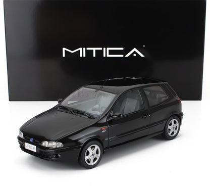 Black Mitica model car 2.0 16V three-door hatchback displayed with branded backdrop, available on Vroomi