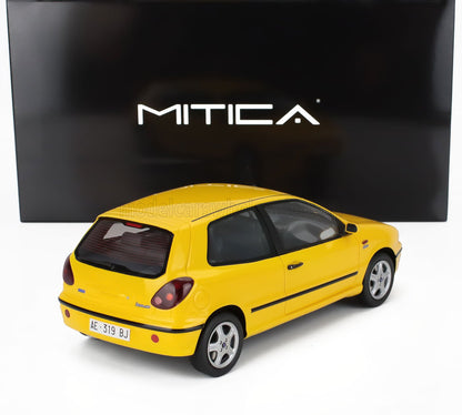 Yellow Fiat Bravo HGT model car displayed with MITICA logo, available on Vroomi platform
