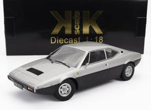 Silver and black 1:18 scale diecast Ferrari 308 GT4 model car with detailed rims, available via Vroomi