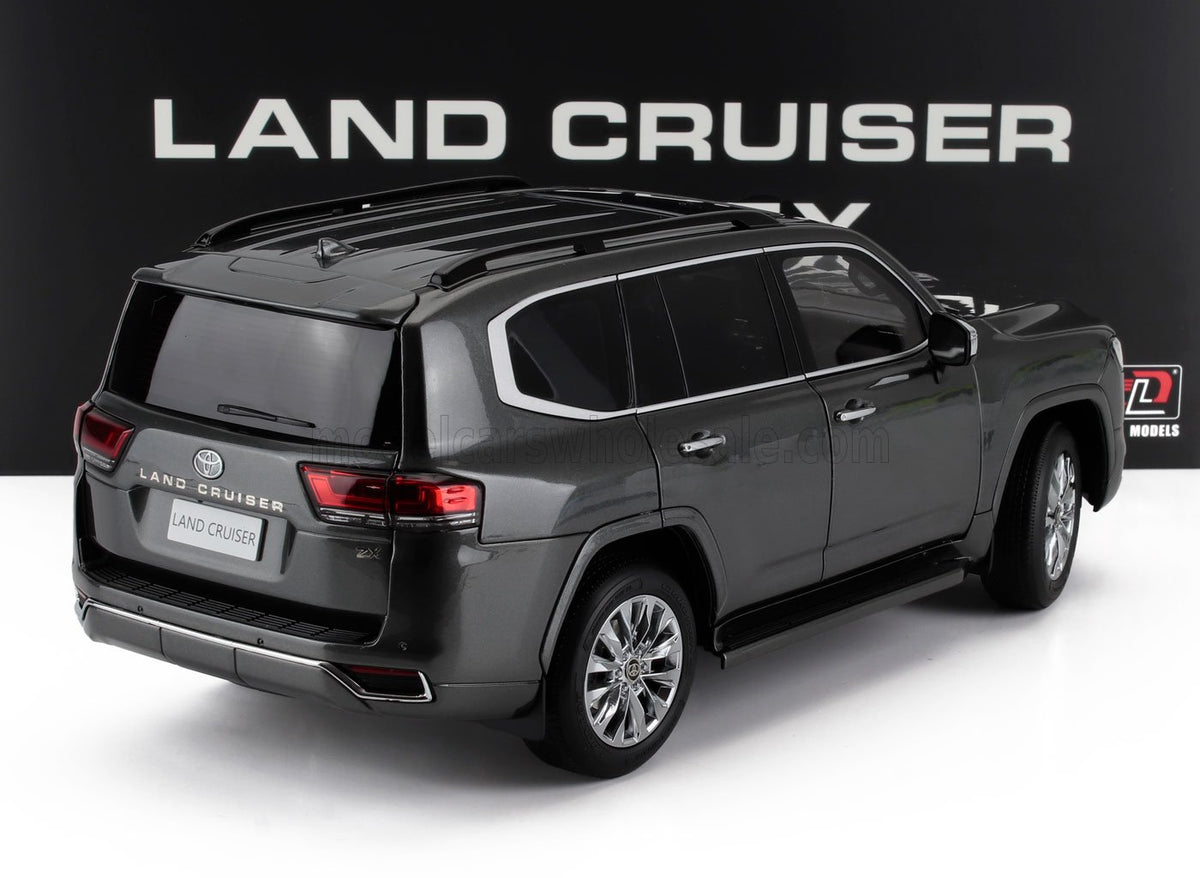 Voiture miniature Toyota Land Cruiser ZX grise par Vroomi, vue arrière détaillée avec barres de toit et jantes en alliage