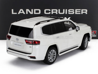 White Toyota Land Cruiser ZX model SUV with black roof rails displayed, now accessible on Vroomi