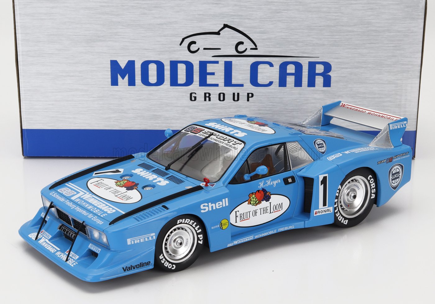 Blue Fruit of the Loom Lancia race car model with sponsor decals on white surface, available at Vroomi