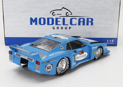 Blue 1:18 die-cast Lancia racing model car with Fruit of the Loom livery by Model Car Group, available at Vroomi