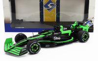 Green and black Stake F1 scale model car from Vroomi, detailed with P Zero tires and sponsor logos.