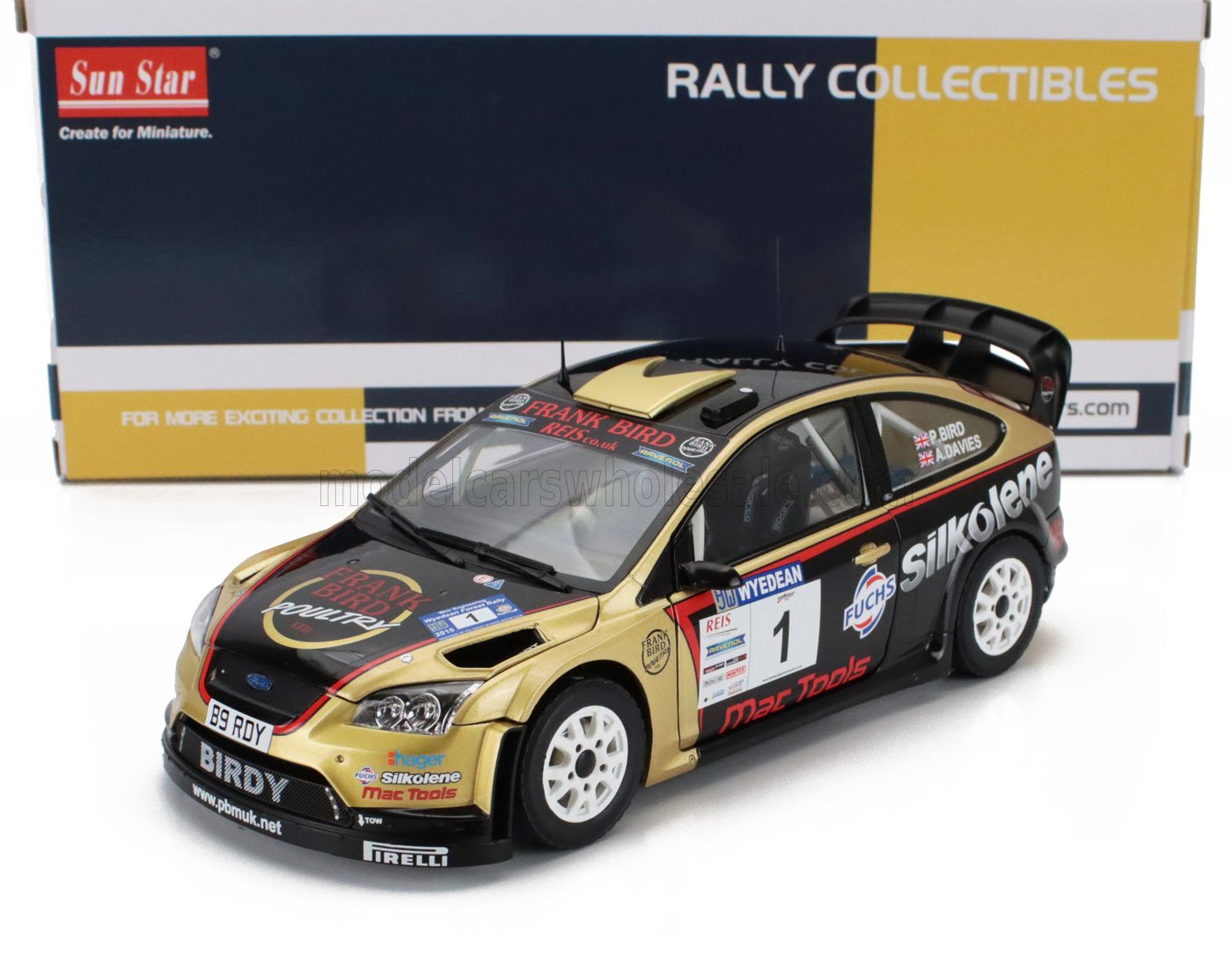 1/18 scale Ford rally car die-cast model with gold and black livery, available at Vroomi