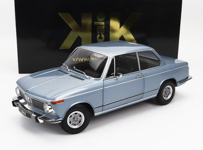 Light blue BMW 2002 model car with black and gold KK scale box, available on Vroomi platform