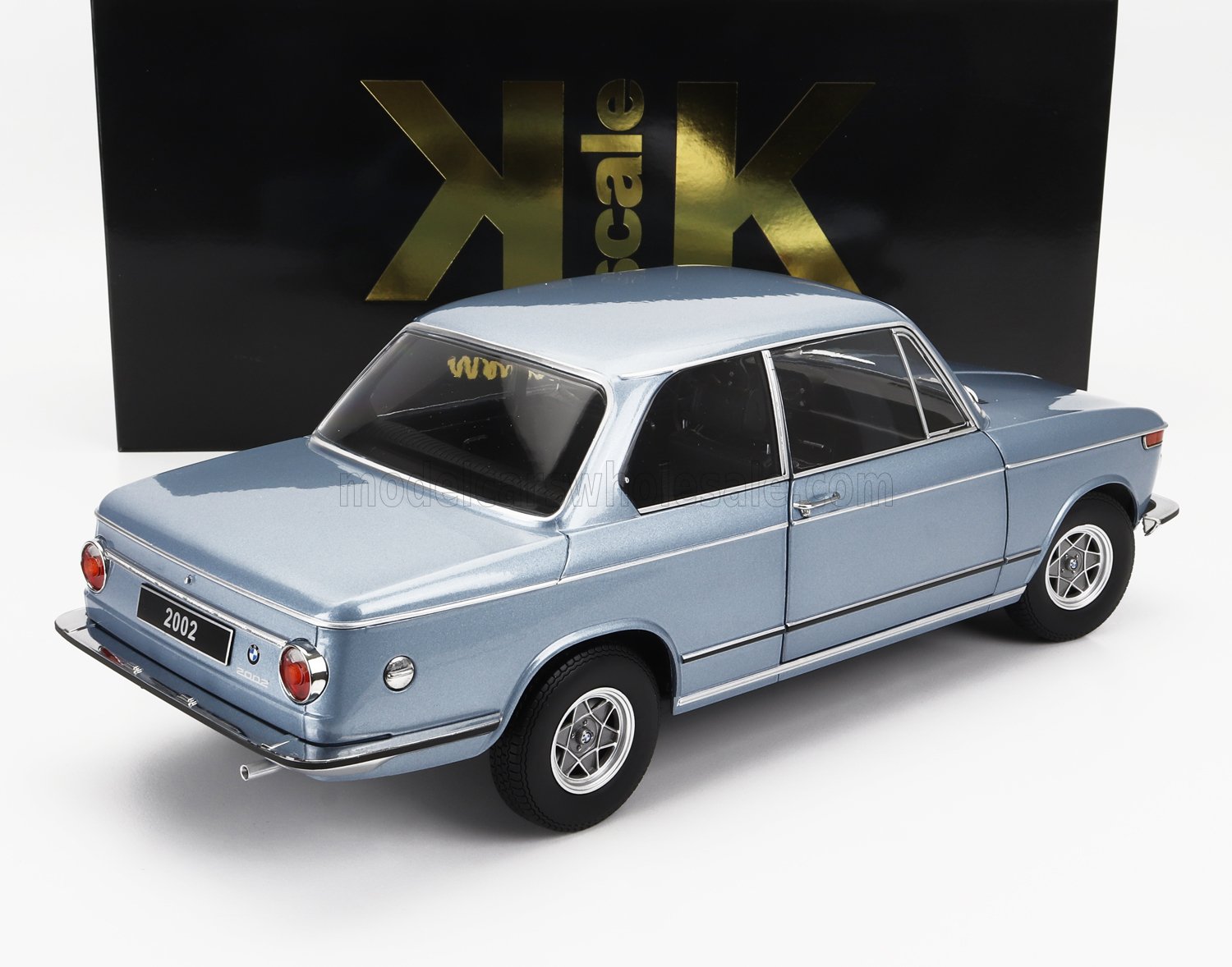 Blue vintage BMW 2002 model car with black and gold KK scale box available on Vroomi