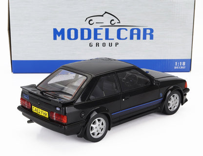 Black 1:18 scale die-cast Ford Escort RS Turbo model car with rear spoiler, displayed in front of Model Car Group box, available at Vroomi