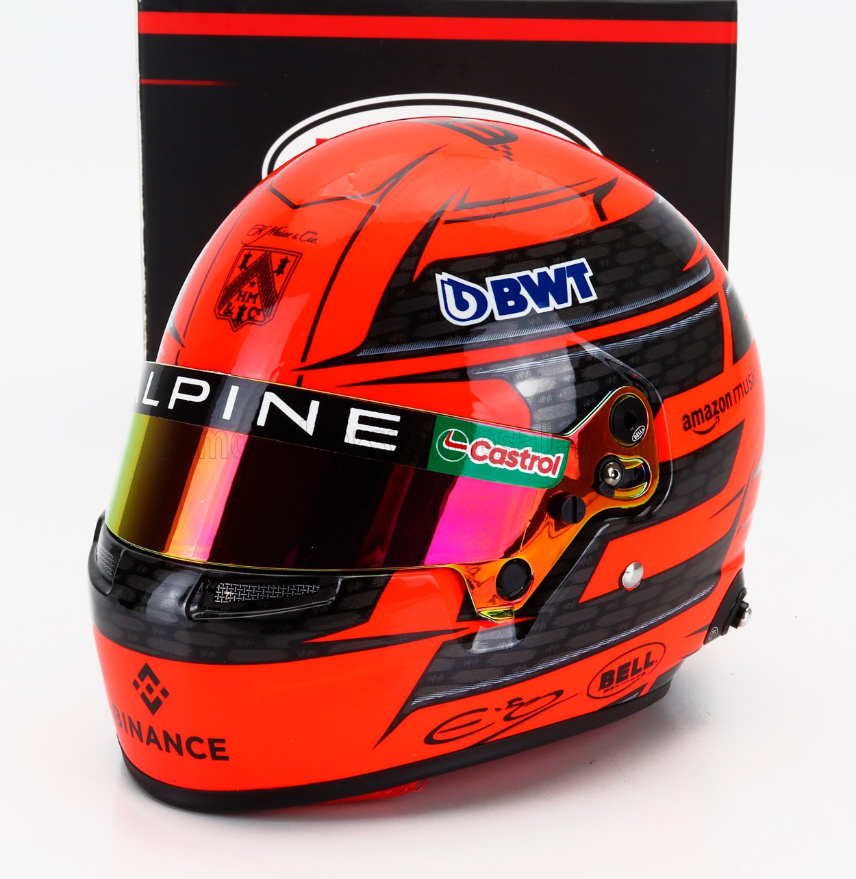 Vroomi scale model car helmet with BWT, Castrol, and Alpine branding, vibrant orange design