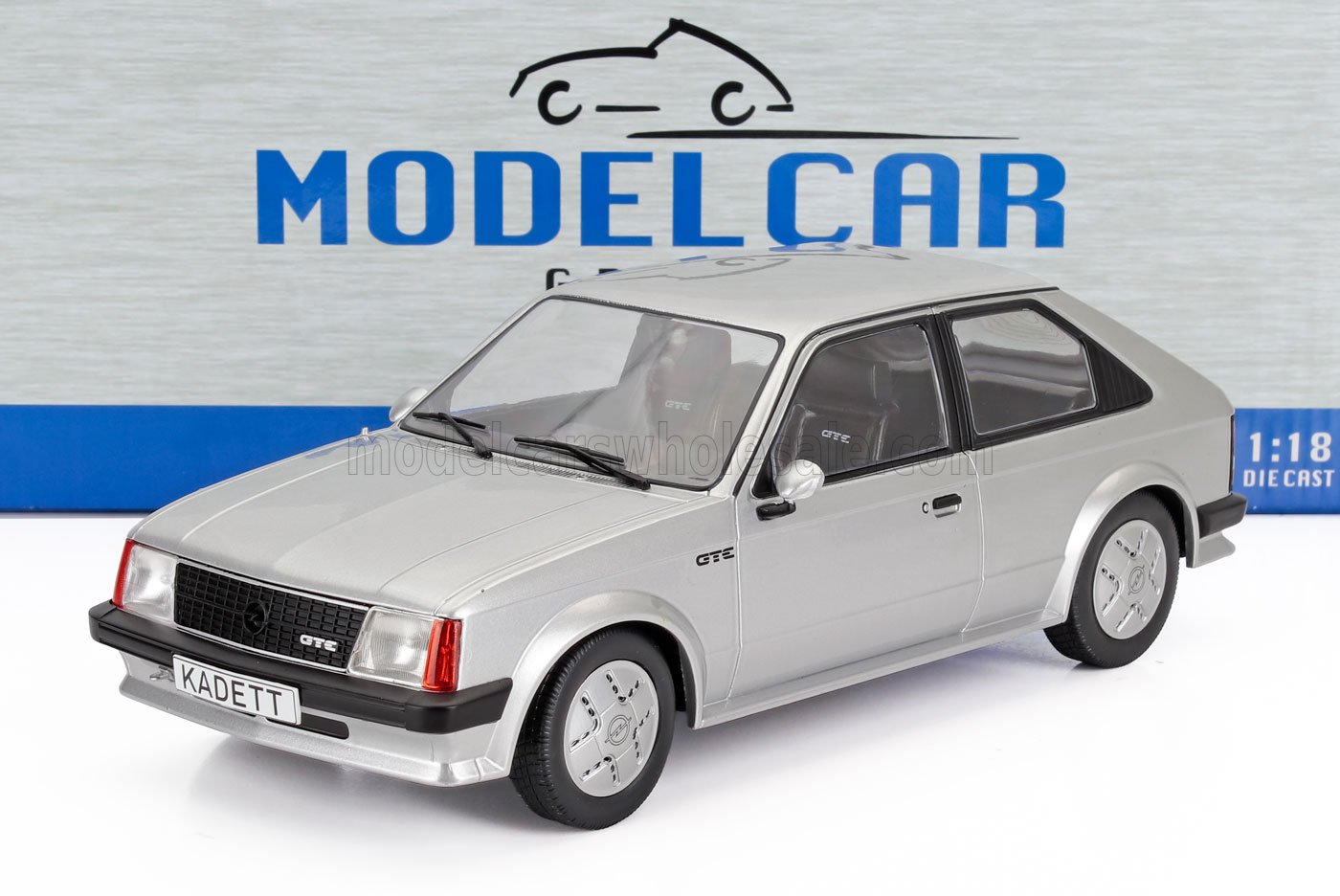 Silver 1:18 scale Opel Kadett GTE die-cast model car on white surface, available at Vroomi