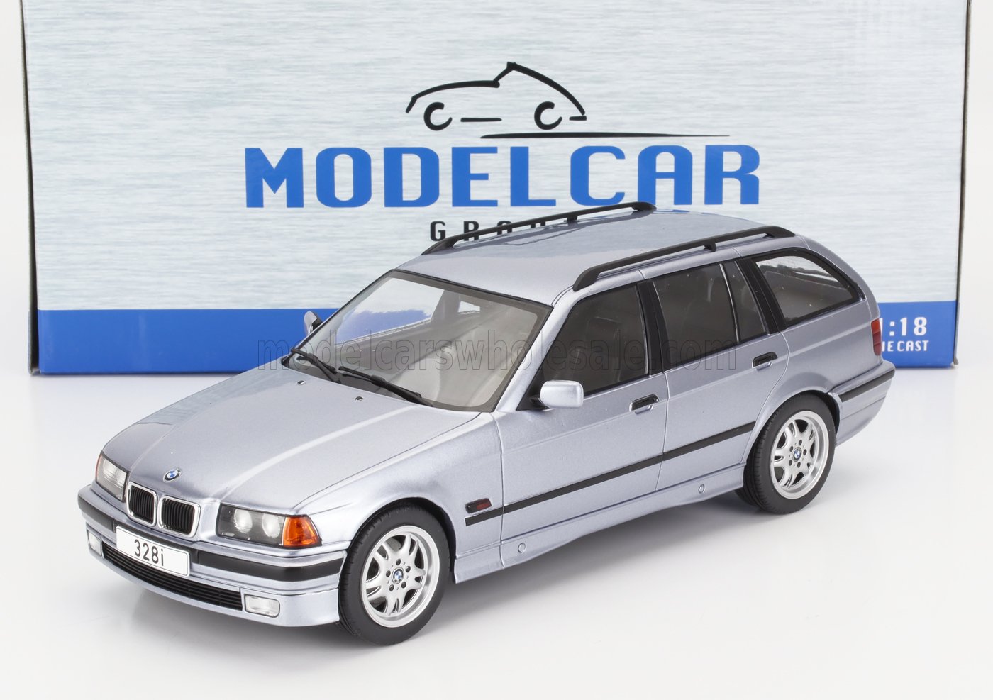 Silver BMW 328i 1:18 scale die-cast model wagon with roof racks available at Vroomi collectors shop