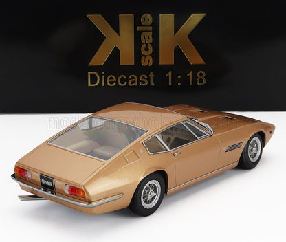Gold 1:18 scale diecast Maserati Ghibli model car displayed on white surface, sold on Vroomi