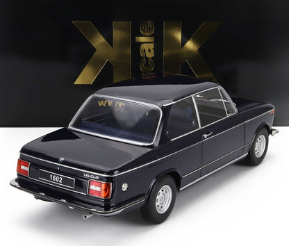 Black BMW 1602 classic model car with silver details on white surface, available via Vroomi platform