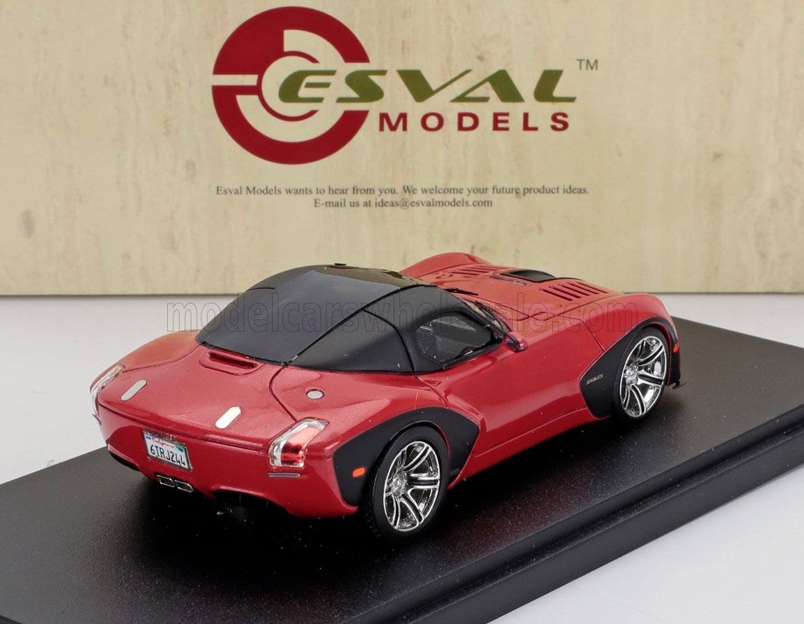 Red Esval Models sports car scale model displayed on black base with logo backdrop, available via Vroomi