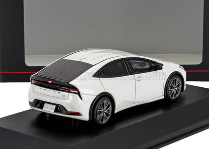 White 2023 Toyota Prius model car displayed on black platform, available via Vroomi
