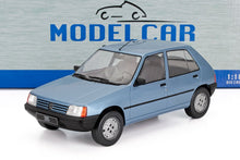 Light blue Peugeot 205 die-cast scale model car 1:18 with detailed interior, available at Vroomi