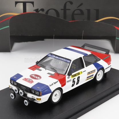 Audi Sport model race car with red, white, and blue livery, mounted on a display base, available through Vroomi