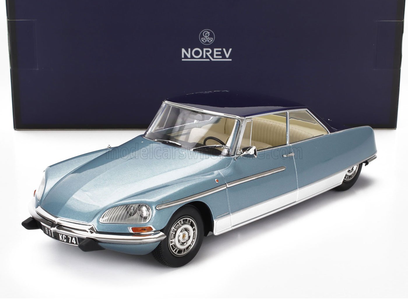 Blue and white Norev Citroën DS model car with cream interior, available through Vroomi platform