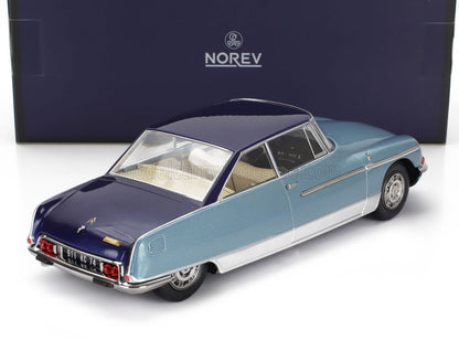Blue and navy Norev model car with white interior displayed with branded box, available on Vroomi