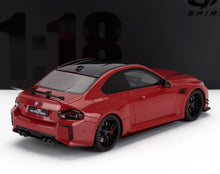 Red BMW AC Schnitzer M4 scale model car with black roof, spoiler, and quad exhausts, available at Vroomi