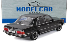 Black 1/18 scale Mercedes-Benz 350 SE model car with detailed chrome trim and classic wheels, available at Vroomi