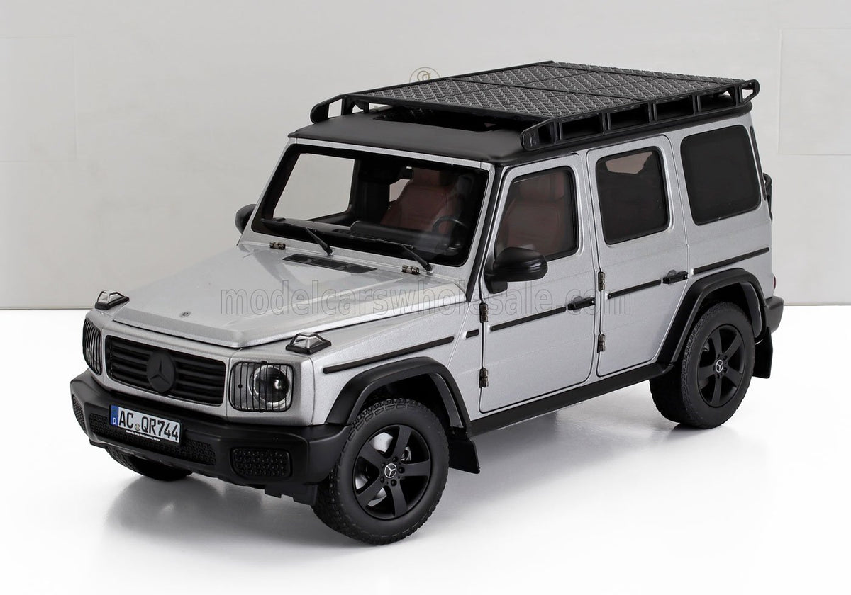 Silver Mercedes-Benz G-Wagen scale model car with roof rack, featured at Vroomi for collectors.