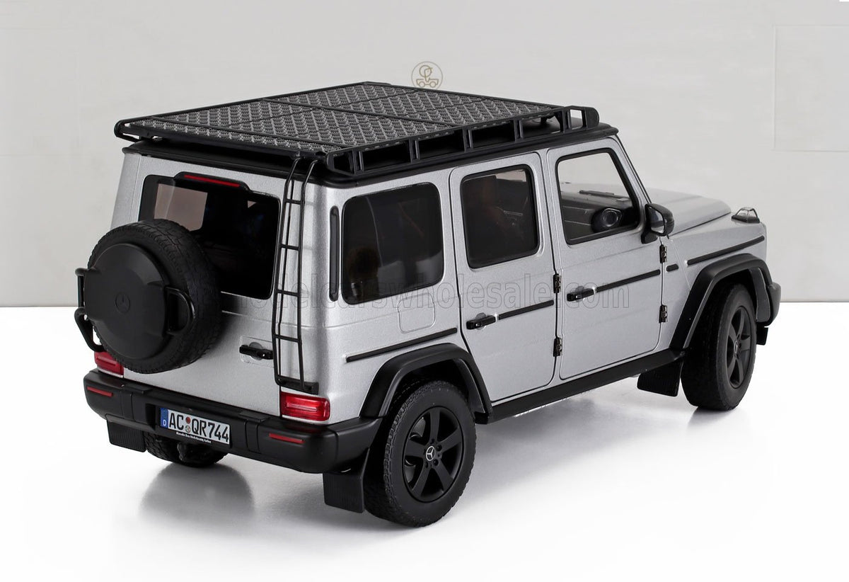 Silver Mercedes G-Wagen scale model car with roof rack, featured by Vroomi for collectors.