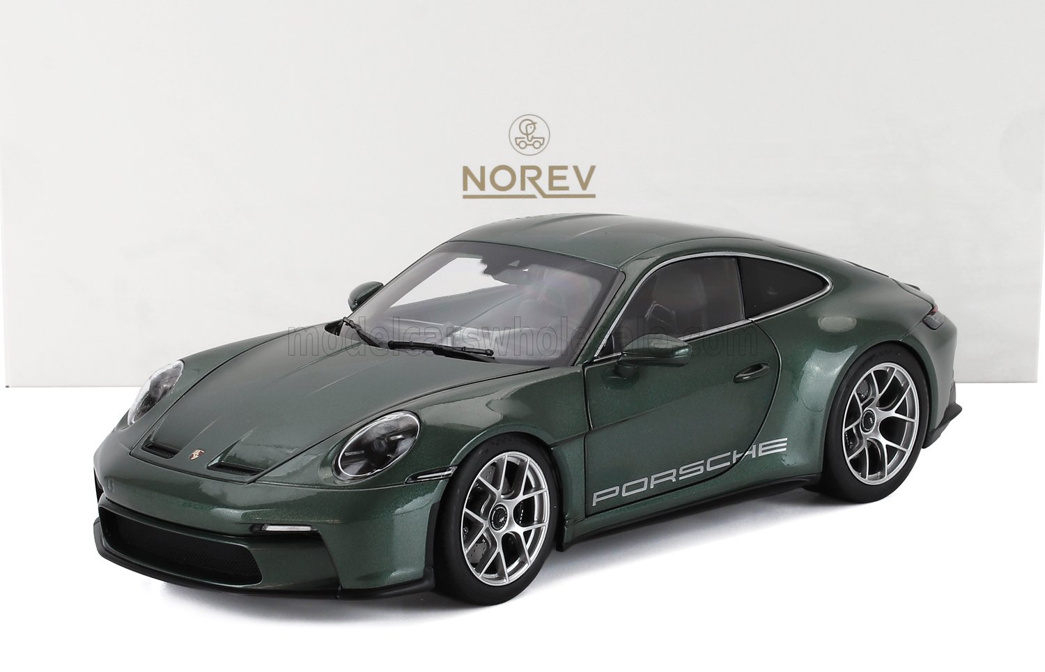Dark green Porsche 911 model car by Norev with detailed wheels and Porsche branding, offered on Vroomi