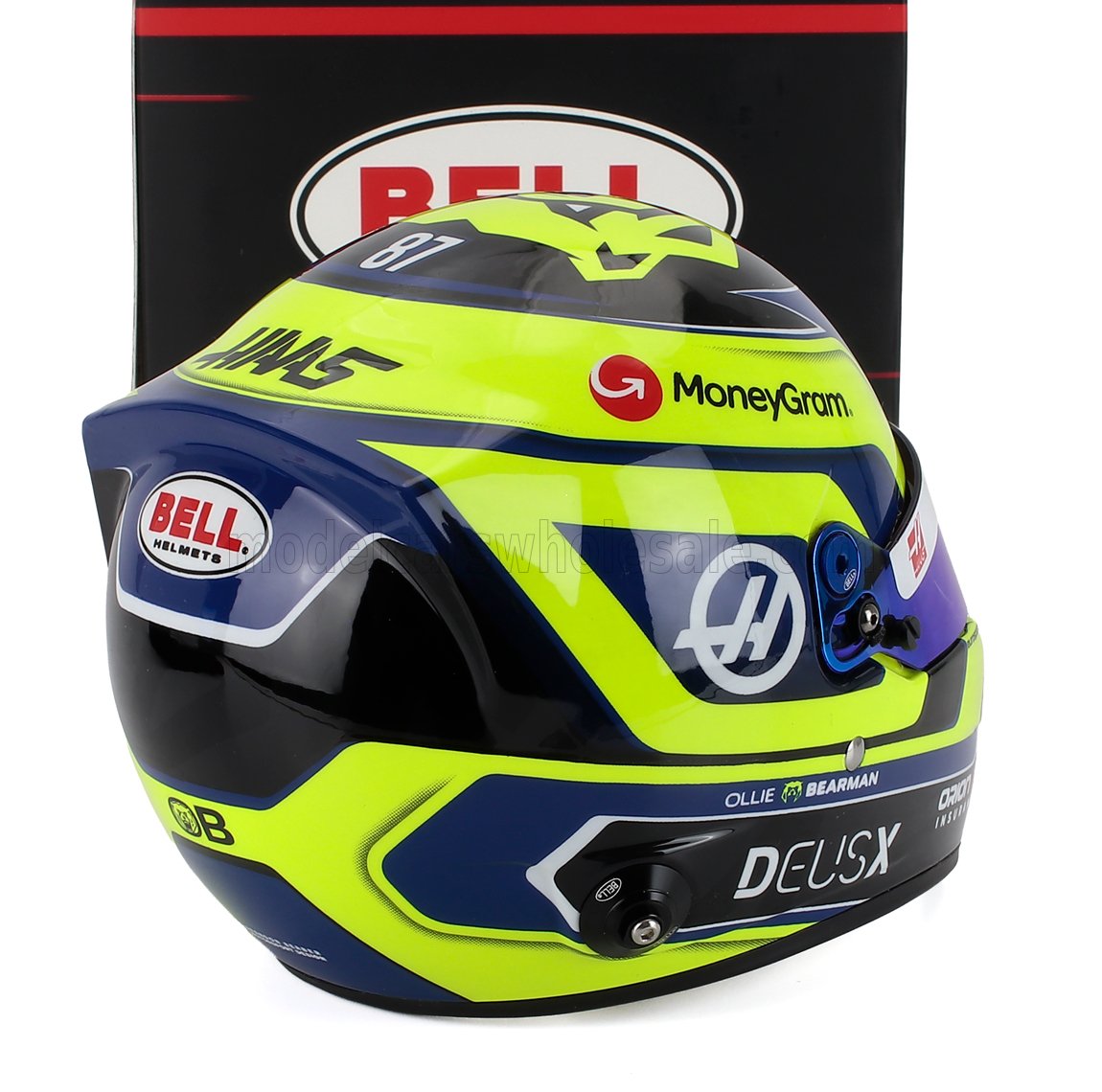 Scale model car helmet by Vroomi, featuring HAAS F1 livery, Bell branding, and MoneyGram sponsorship.
