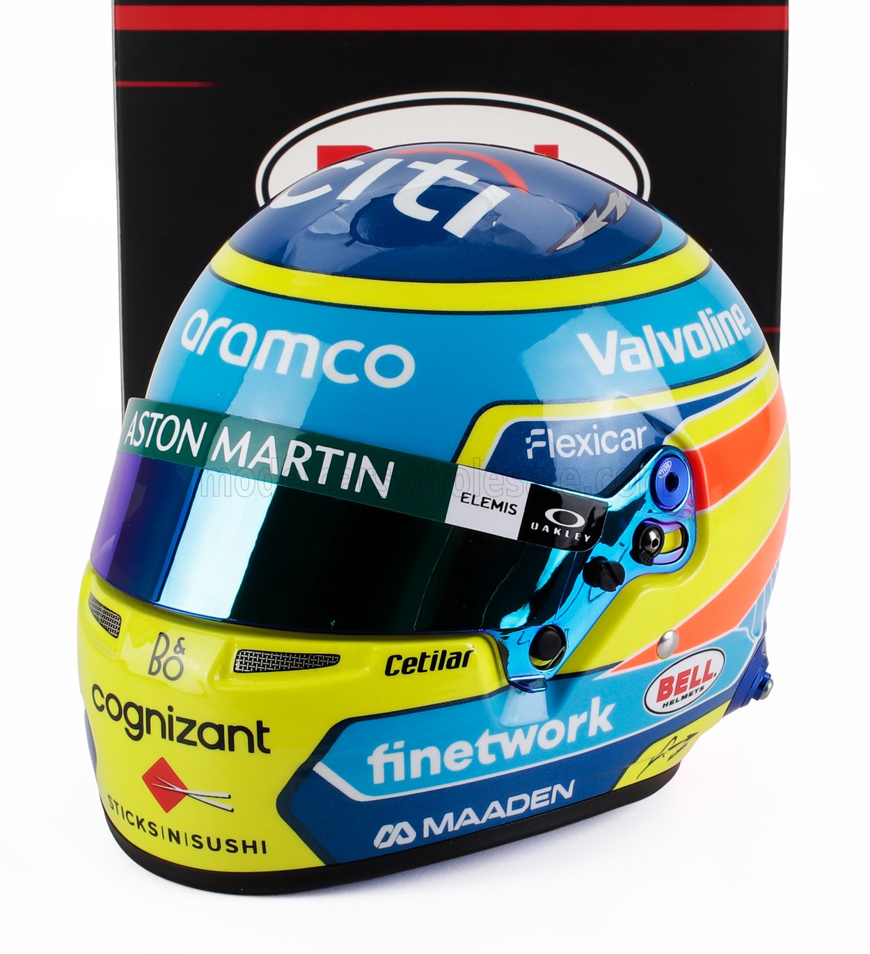 Colorful racing helmet with Aston Martin and various sponsor logos, available on Vroomi platform
