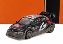 Diecast model of black and red rally car #18 with sponsor logos, featured on Vroomi platform