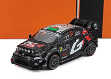 Black Toyota GR rally car model with #33, Hankook decals, and roof Wales flag, available on Vroomi